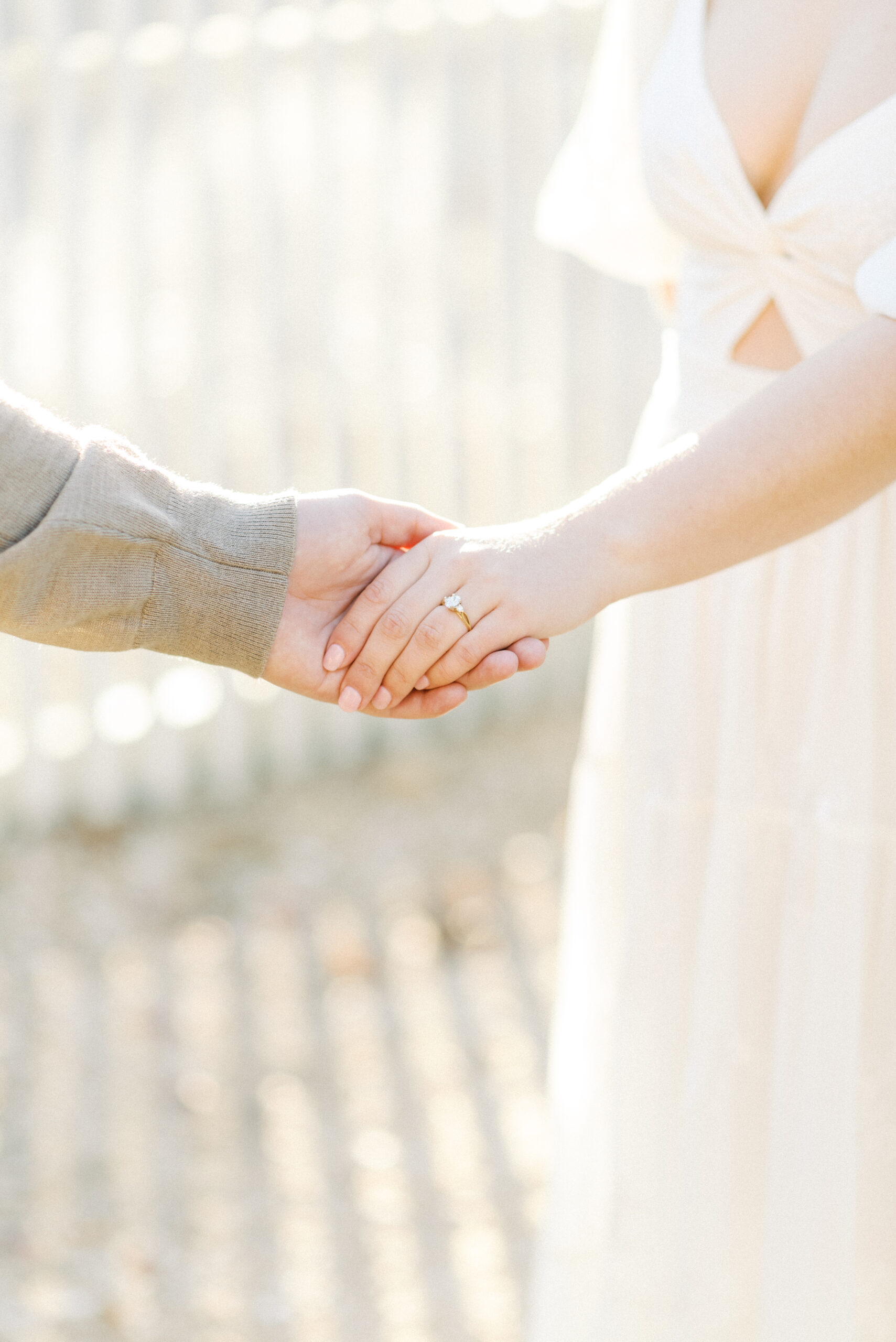 Bride and groom holding hands during their engagement photos