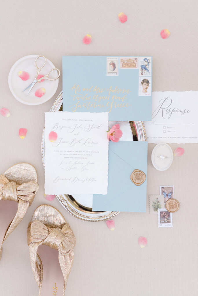 Blue and white wedding invitation suite with pink flowers and gold Loeffler Randall shoes