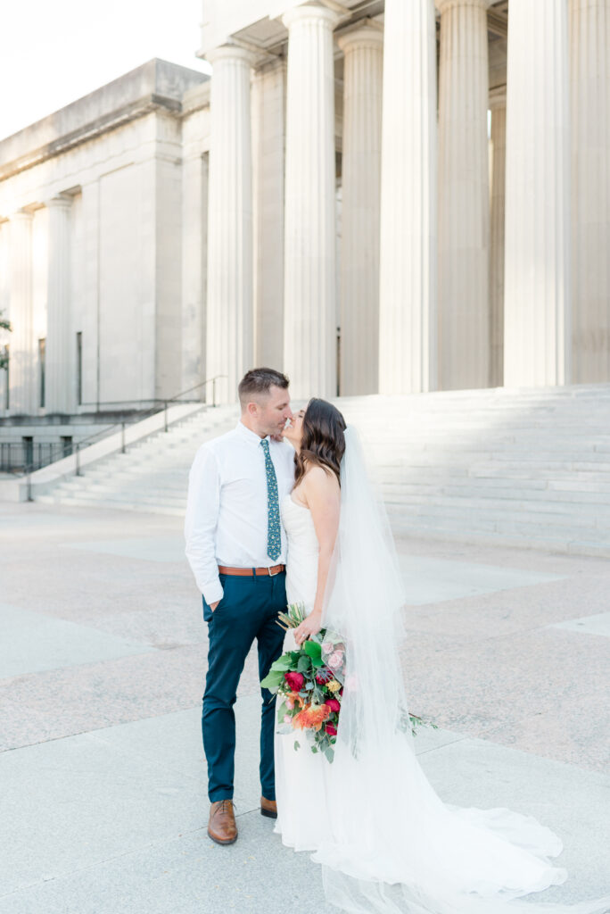 Bride and Groom kiss outside the courthouse after eloping in Virginia