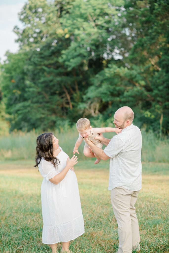 Family playing with baby bot during family photo session in Williamsburg, Virginia