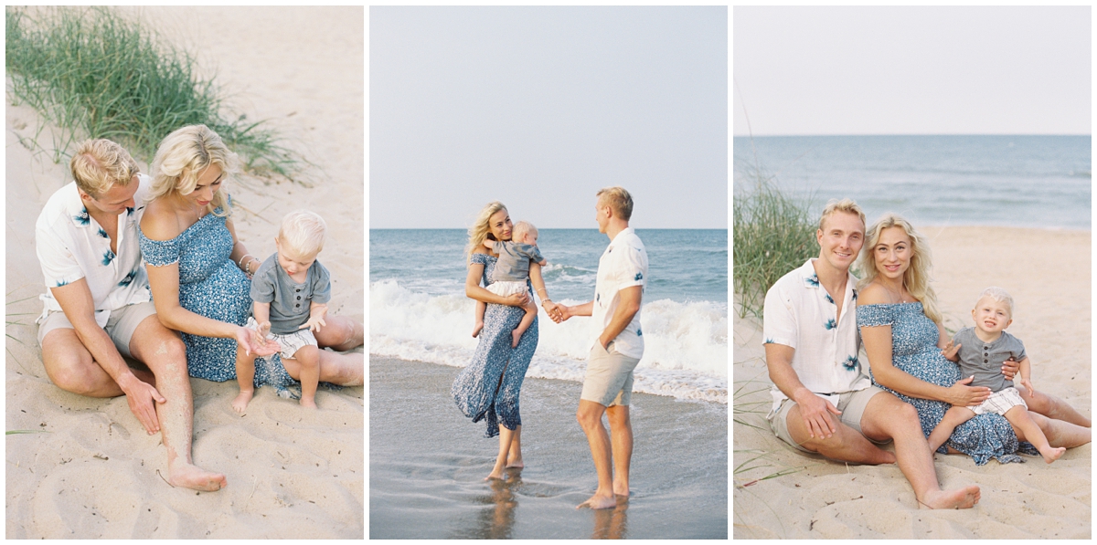 Family wearing blue and neutral colors playing in the surf at Virginia Beach during lifestyle maternity photos